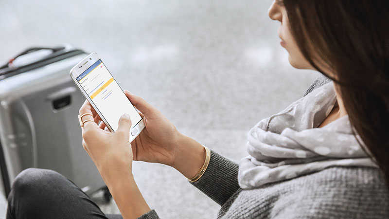 woman shopping on mobile using visa checkout